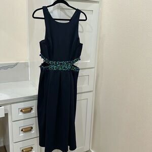 Beautiful navy dress with sequin detail and cut out sides.